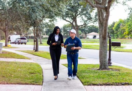 Two people in a community working on a preventive maintenance plan