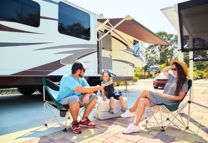 a family at an RV resort community