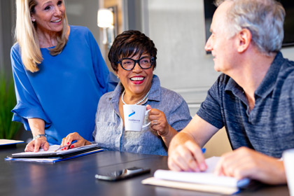 Board members discuss HOA myths at a conference table