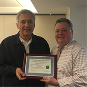 Walter Kondeusz (left) receives Best Maintained Vintage Award from FirstService Residential, presented by Robert Meyer (right).